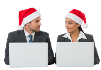 Business colleagues with Santa hats working on laptops
