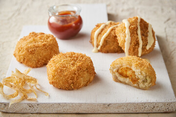 Close up of a potatoe croquet stuffed with shrimps
