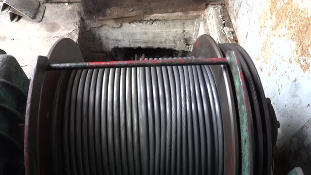 Stockholm, Sweden A large electric motor-powered spool rotating with steel cable.