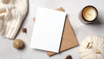 Flat lay of Thanksgiving greeting card mockup with pumpkin and candle. Ideal for festive, warm, and seasonal graphic design use