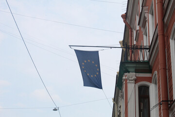 European Union flag on a building with sky background
