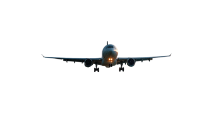 A front-facing airplane with lit landing lights, appearing against a solid black background