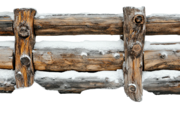 Weathered wood fence with snow accents
