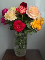 Colorful garden roses in a vase