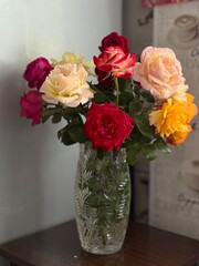 Colorful garden roses in a vase