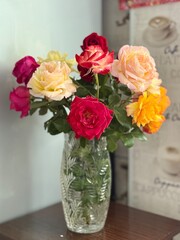 Colorful garden roses in a vase