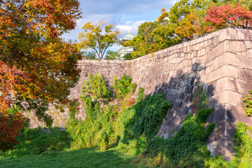 Walls surrounding Osaka castle in autumn, Japan