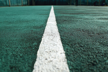 
White line on Rubber Field in Badminton court
