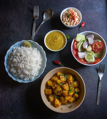 Indian lunch menu veg meal served in bowls. Top view, selective focus.
