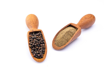 Black peppercorns and ground black pepper powder on white background