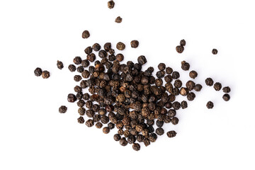 Black peppercorns on white background