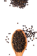 Black peppercorns on white background	
