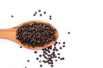 Black peppercorns on white background	
