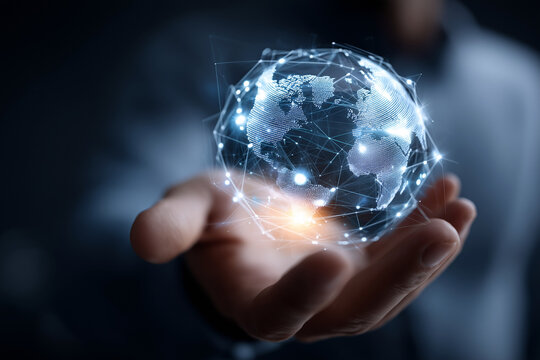 A man is holding a globe in his hand