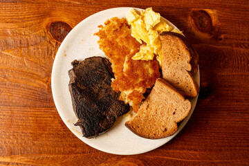 Steak, eggs, hash browns and toast