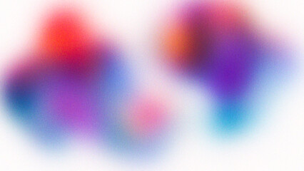 Abstract blurry colorful splashes of red blue and purple paint on a white background