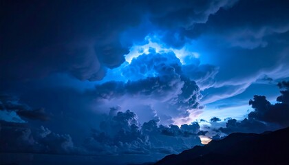 A dramatic, high-contrast image capturing a stormy sky with ominous, swirling clouds illuminated by intense blue and white light. Mountains silhouette the scene