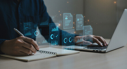 Digital Document Management and Data Analysis: Person Working on Laptop and Writing Notes with Holographic Business Icons