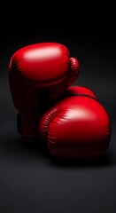 Red Boxing Gloves on Black Background - A Study in Contrast.