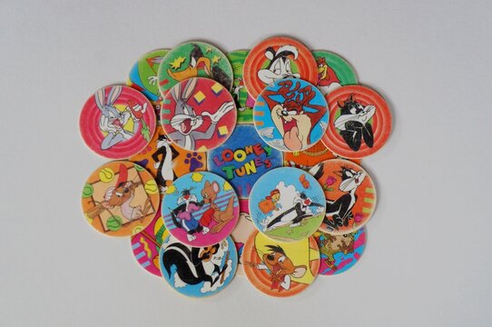 Salvador, Brazil - May 20, 2025: Tazos Collection on White Background. Tazos are disks that were distributed as promotional items with products of Frito-Lay (Elma Chips). 