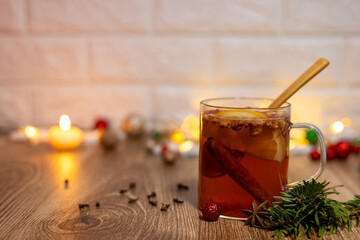 Cup of team on the kitchen table. Christmas decoration background.