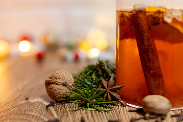 Cup of team on the kitchen table. Christmas decoration background.