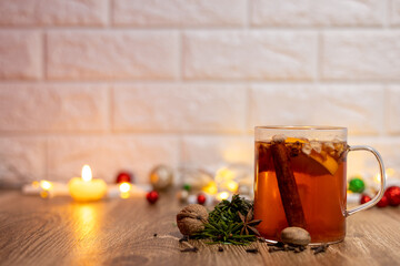 Cup of team on the kitchen table. Christmas decoration background.