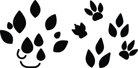 Fototapeta premium Seamless vector pattern of abstract black and white leaves and paw footprints for a natural animal print wallpaper design