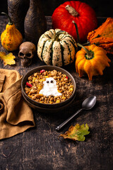 Halloween breakfast. Granola and ghost from yogurt