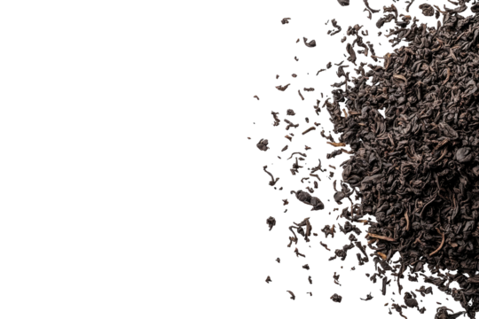 Dark, dry tea leaves scattered on the right over a stark black background