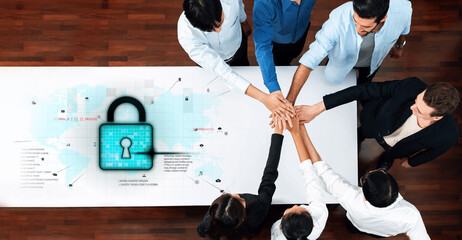 A diverse team collaborates in a modern office, focusing on enhancing cybersecurity practices while emphasizing teamwork and innovative solutions in a digital landscape. Trope