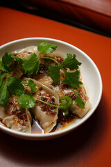 Steamed Dumplings in Chili Oil with Cilantro