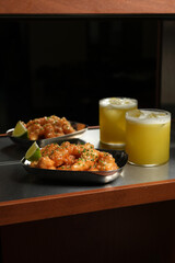 Crispy Shrimp Appetizers and Yellow Cocktail