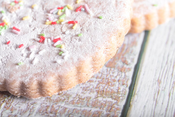 A delightful assortment of cookies and milk with colorful sprinkles on a rustic wooden background, perfect for National Cookie Day celebrations