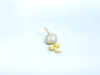 Fresh Garlic Head with Several Peeled Cloves on a Clean White Background, Ready for Cooking
