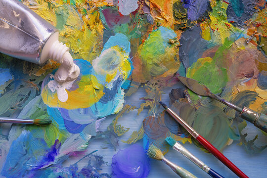 Palette with different oil paints, paintbrushes and palette knife - Powered by Adobe