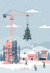 Construction workers hanging Christmas tree from crane in winter  