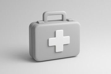 Fototapeta premium White and grey medical kit with a red cross on it. The kit is designed to be used in emergency situations