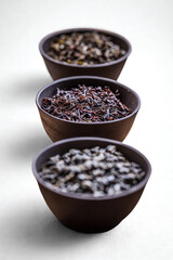 Three bowls of coffee beans showcasing different roasts and varieties
