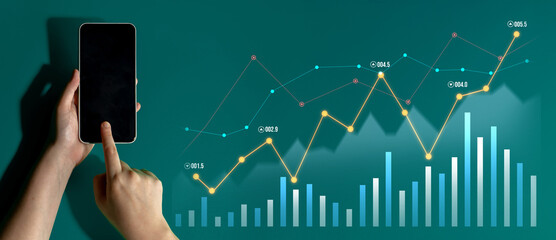 A person interacts with a smartphone displaying financial graphs and charts on a vibrant digital background, highlighting the intersection of technology and financial analysis. Scalp