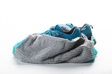 Washing shoes in a washing machine using a special washing bag.