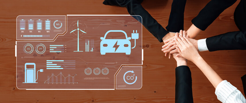 A diverse team collaborates on innovative solutions for sustainable transportation while analyzing data on electric vehicles and renewable energy strategies. Trope