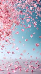 A gentle cascade of delicate pink cherry blossom petals falling gracefully against a soft, ethereal blue sky, creating a dreamlike and romantic atmosphere of springs arrival