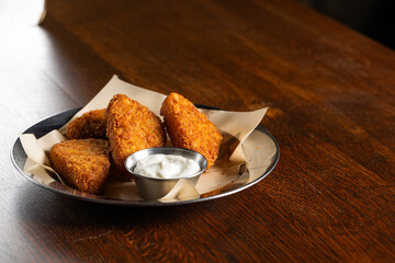 Crispy Fried Cheese Sticks or Hash Browns with White Dipping Sauce
