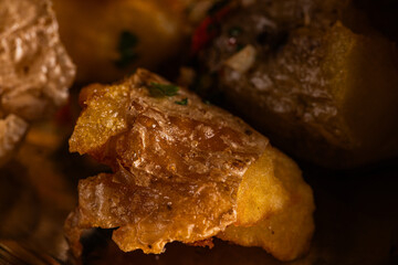 Close-up of Golden Roasted Potato Chunks with Chili and Herbs