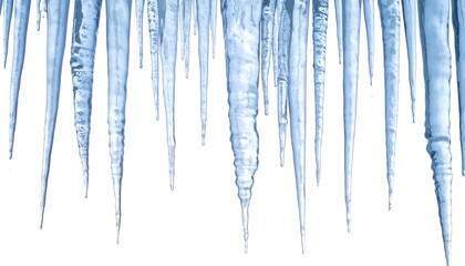 A collection of elongated, translucent, blue-tinged ice formations hanging from above, against a stark white backdrop, creating a frosty effect