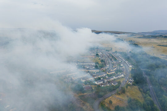 Thick smoke from a moorland fire engulfing a residential area in Wales