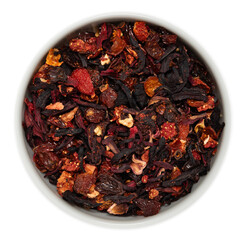 Dried strawberry, hibiscus, and rosehip tea blend in a white ceramic bowl, viewed from above, ideal...