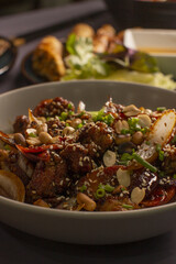 A savory beef stirfry with fresh vegetables, garnished with crunchy sesame seeds for added flavor and texture
