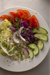 Close up of food with green leaves, showing fresh herbs and vegetables as part of a healthy human diet, reflecting nutrition balance and natural eating habits.